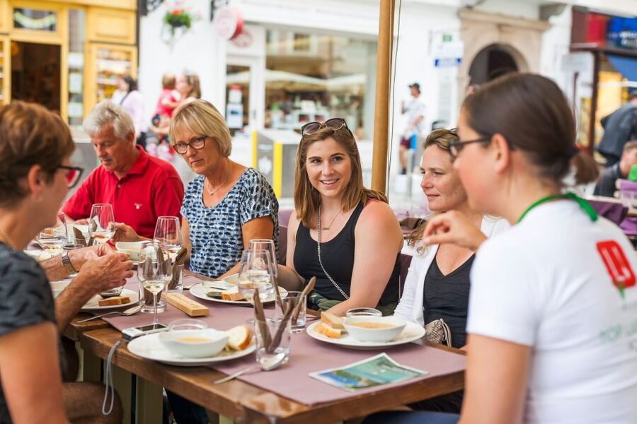 Ljubljana: Slovenian Cuisine Walking Tour with Tastings - Walking through Ljubljana’s old and modern center